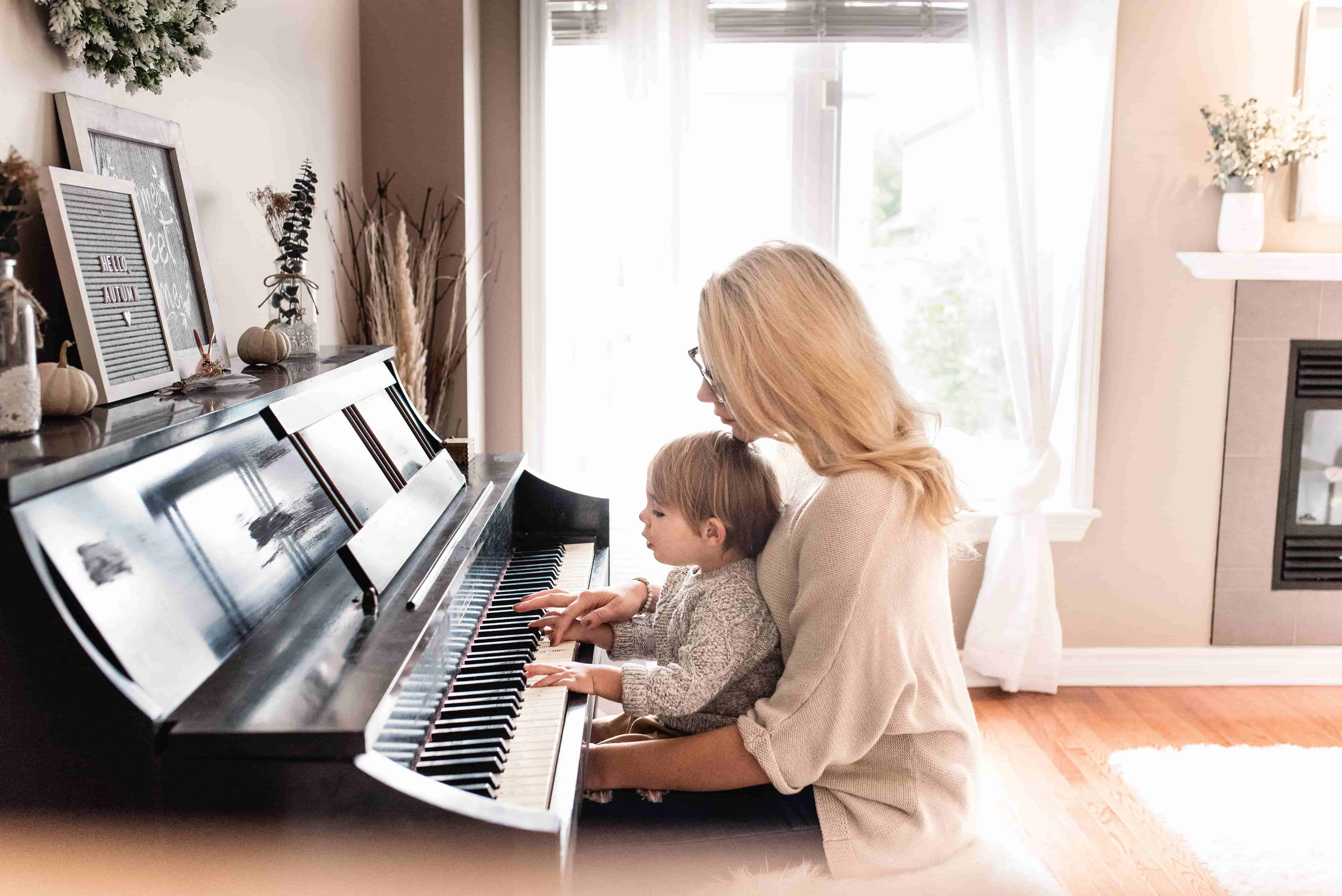 Mother performing with kid on childrens day